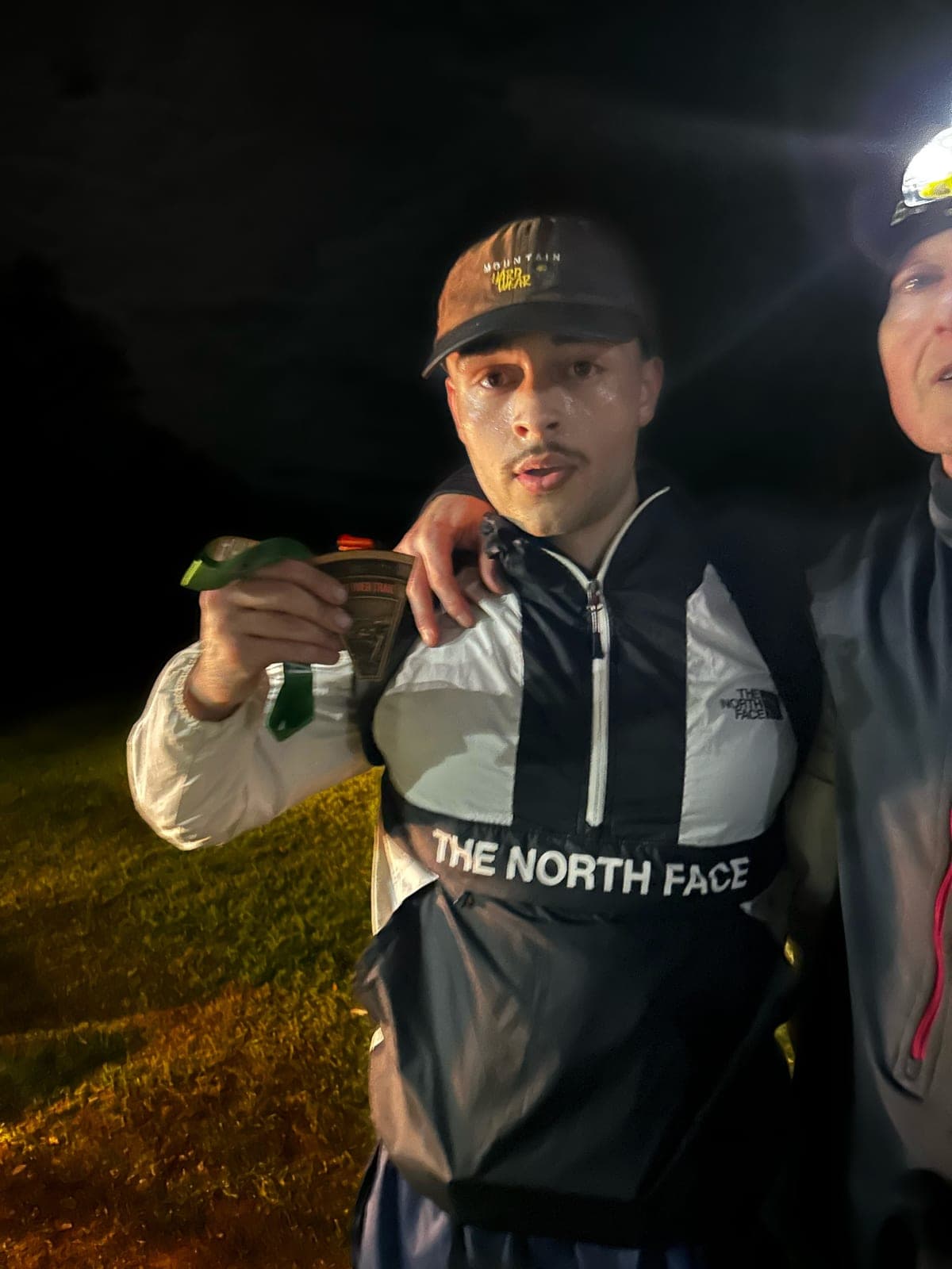 Arun McGoay at the finish of a trail ultramarathon